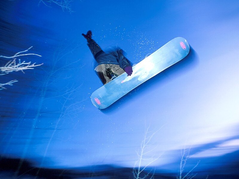 Snowboarder in mid-air jump