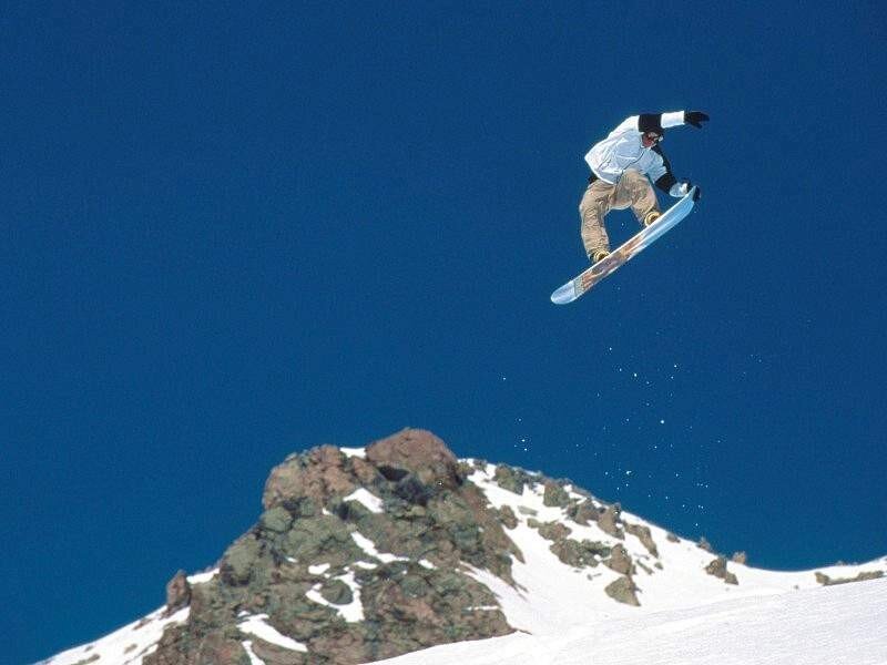 Snowboarder in mid-air jump