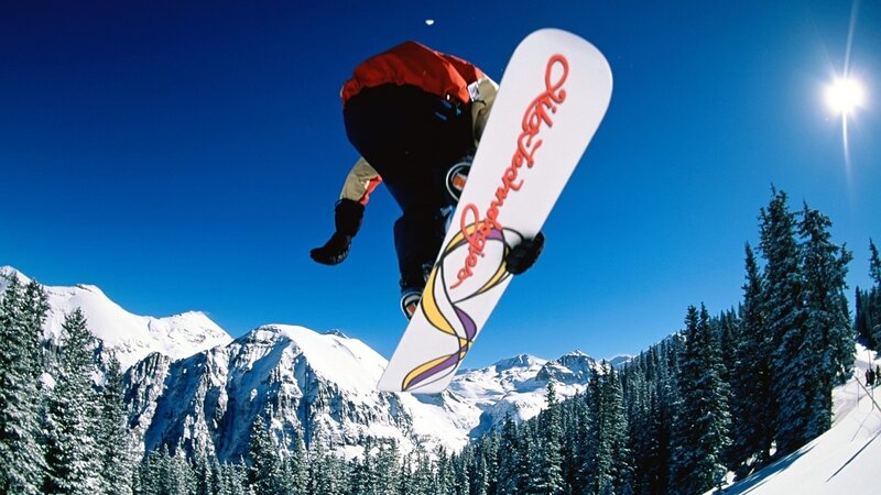 Snowboarder in mid-air jump