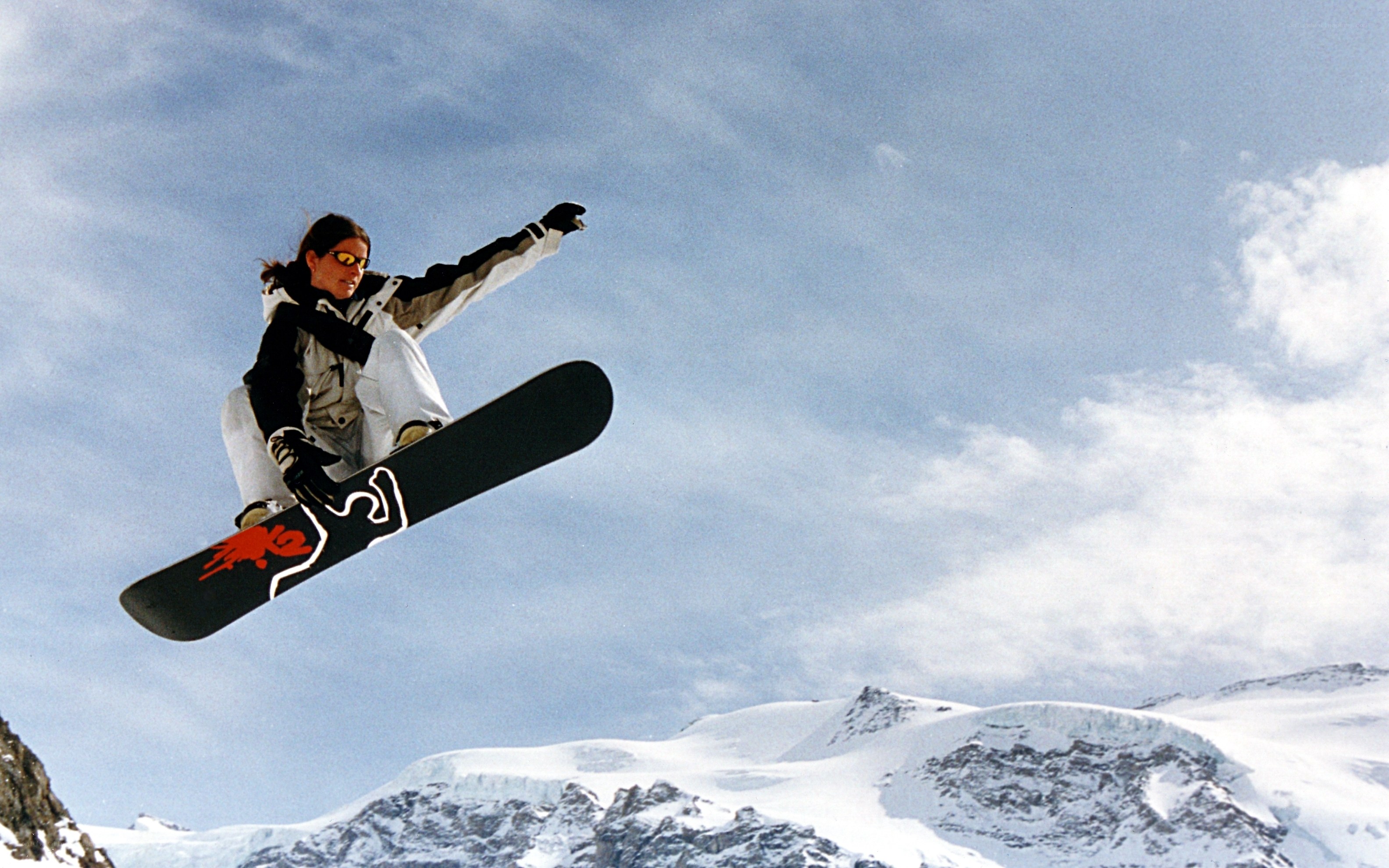 Snowboarder in mid-air jump
