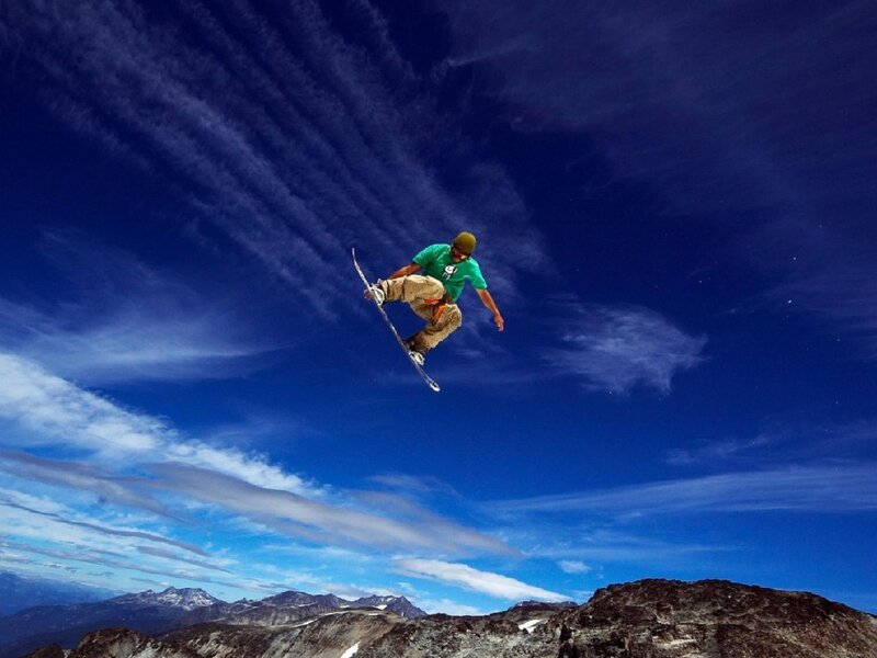 Snowboarder in mid-air jump