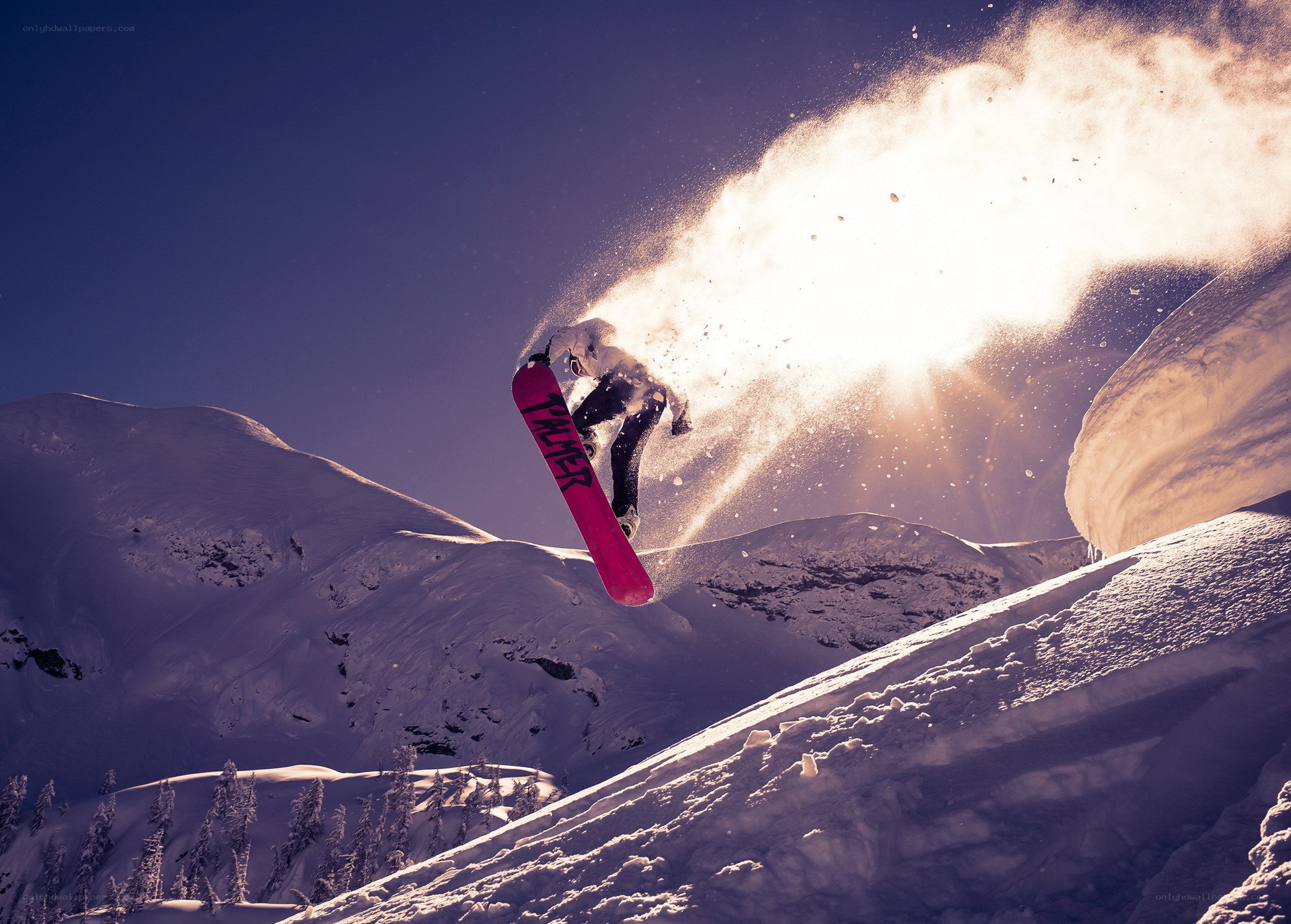 Snowboarder in mid-air jump
