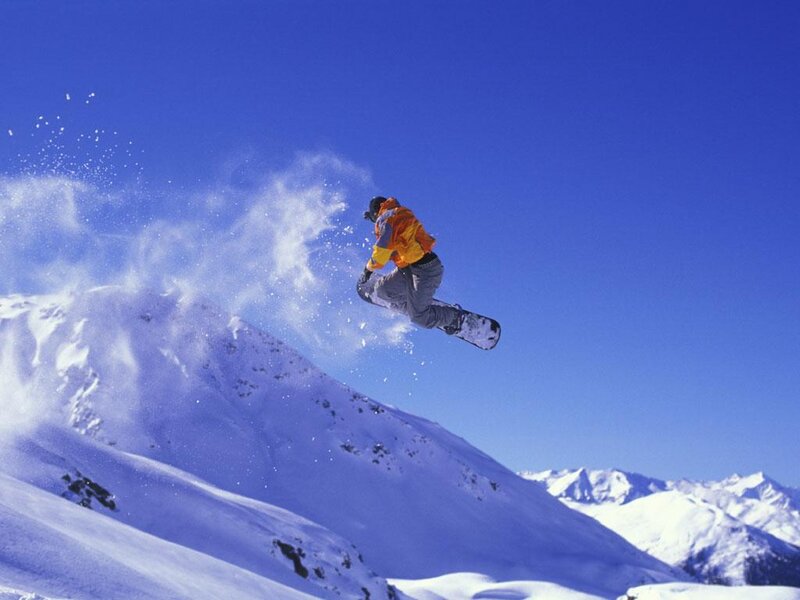 Snowboarder in mid-air jump