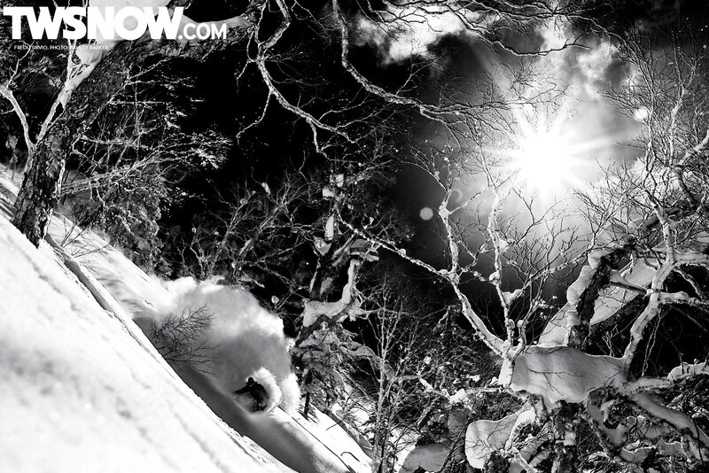 Snowboarder in snowy forest