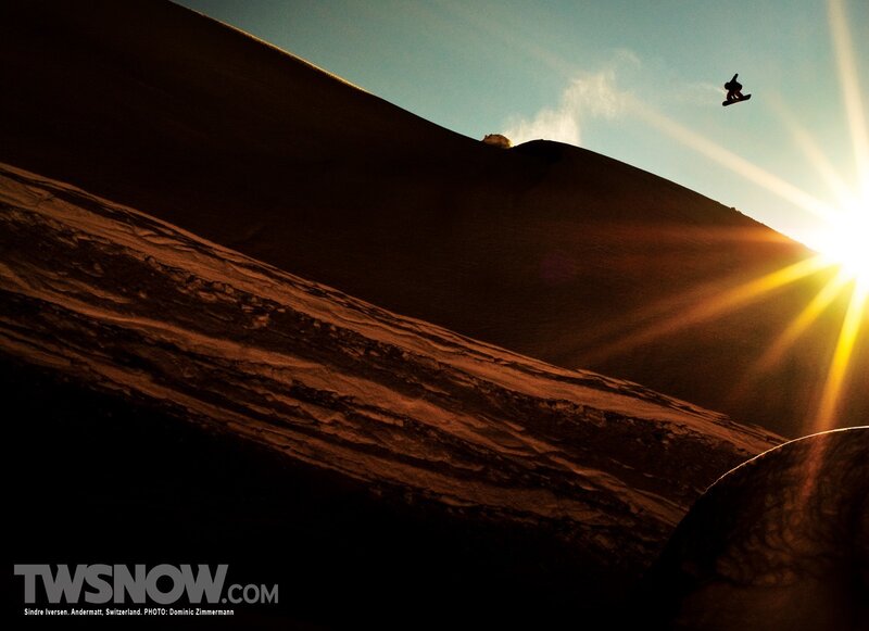 Snowboarder in sunset jump