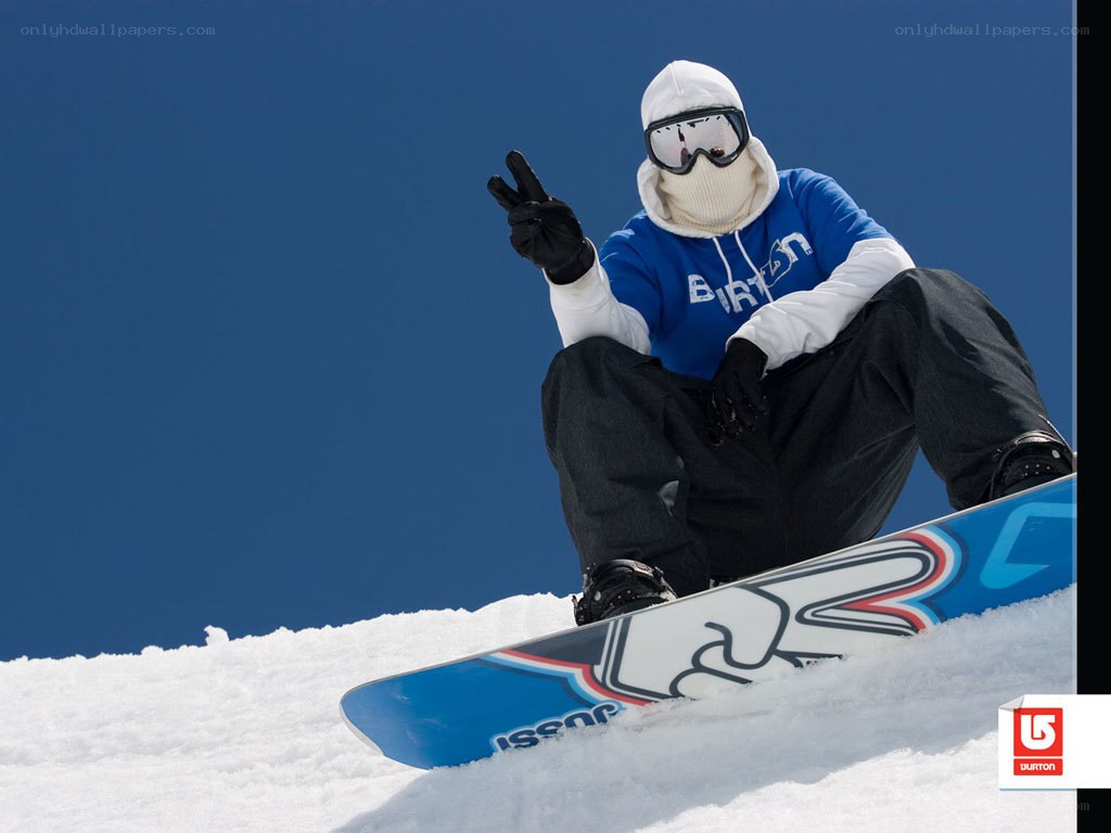 snowboarder making peace sign