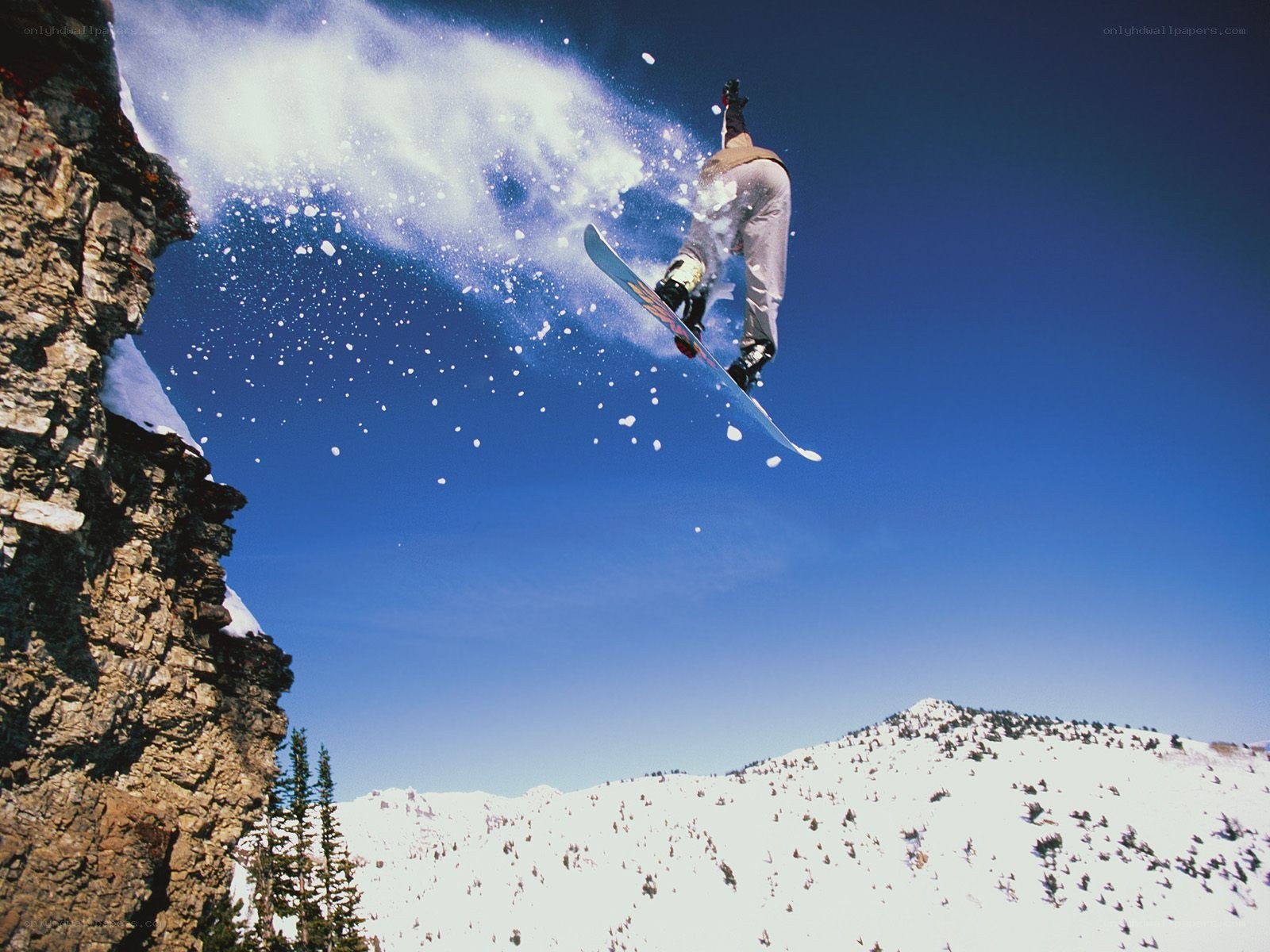 Snowboarder mid-air jump
