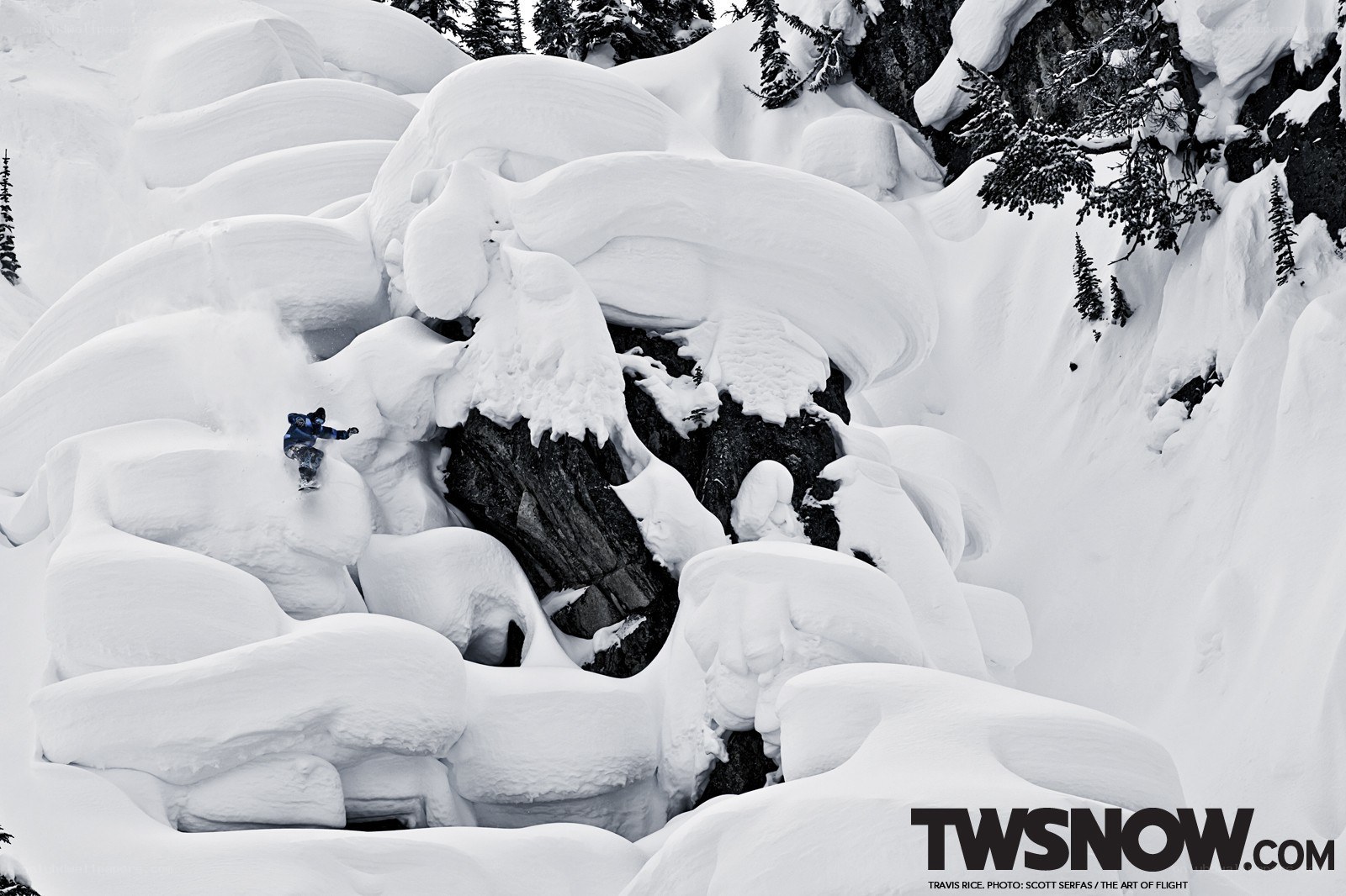 Snowboarder navigating snowy terrain