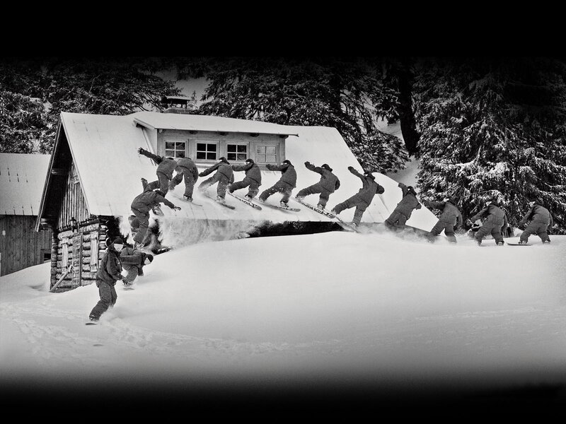 Snowboarder on a cabin roof