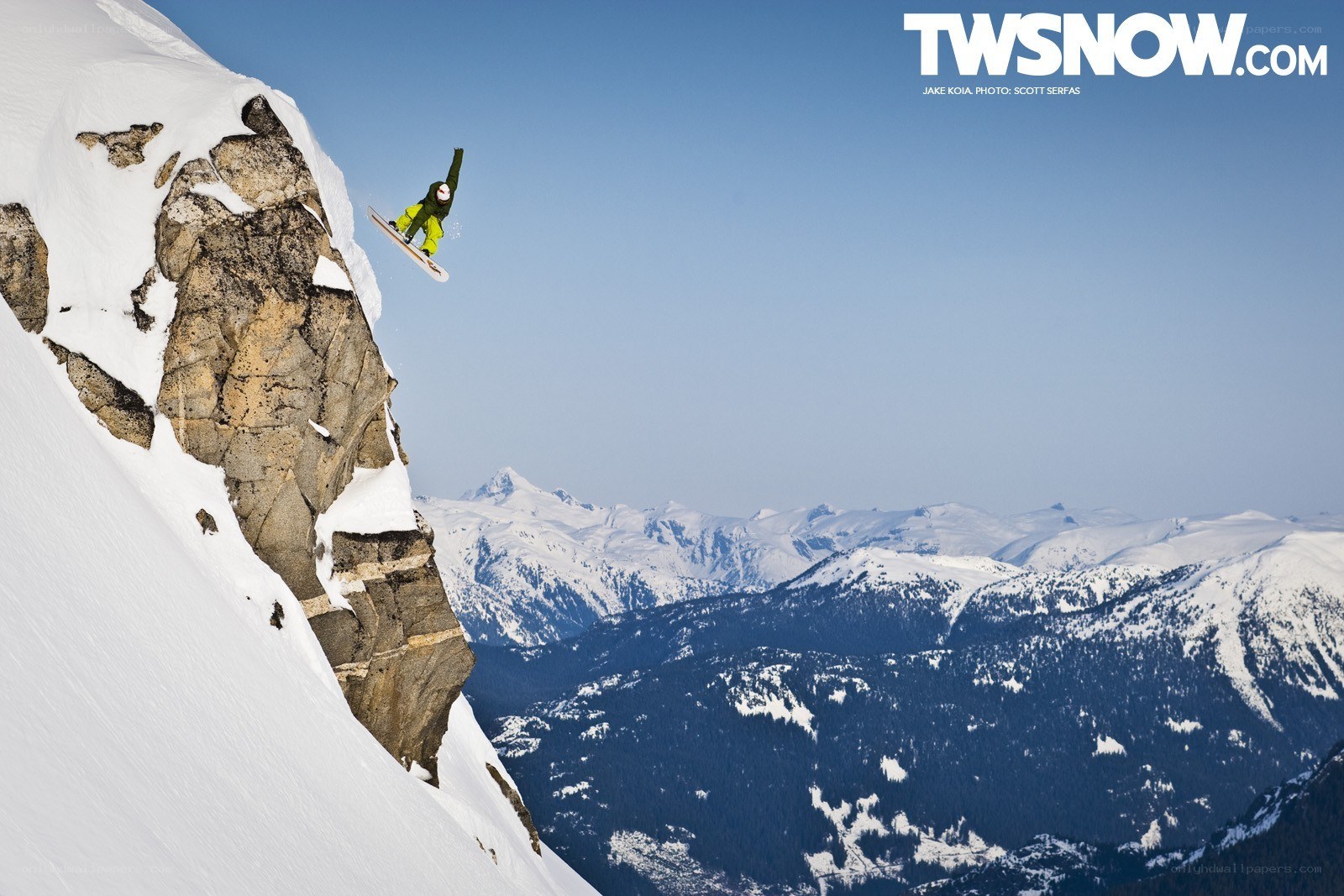Snowboarder on a cliff
