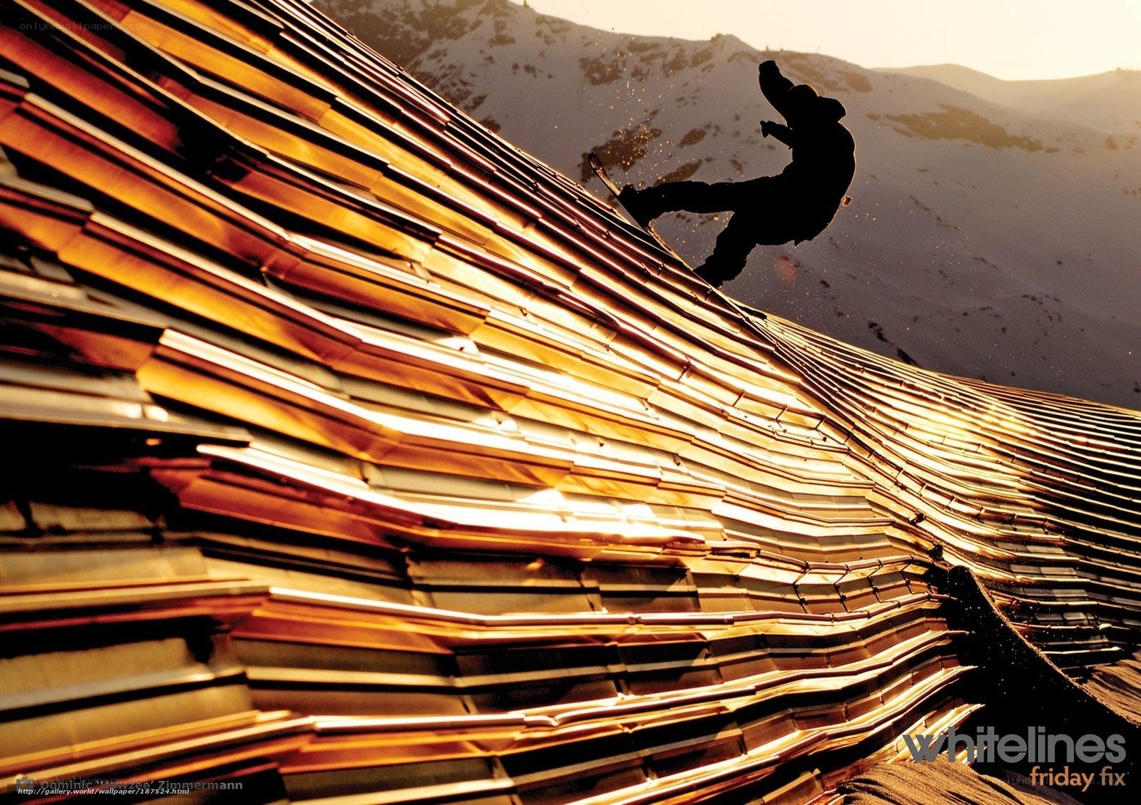 Snowboarder on a golden roof
