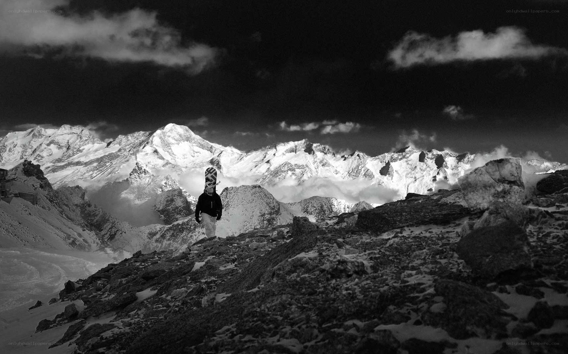 Snowboarder on a mountain peak