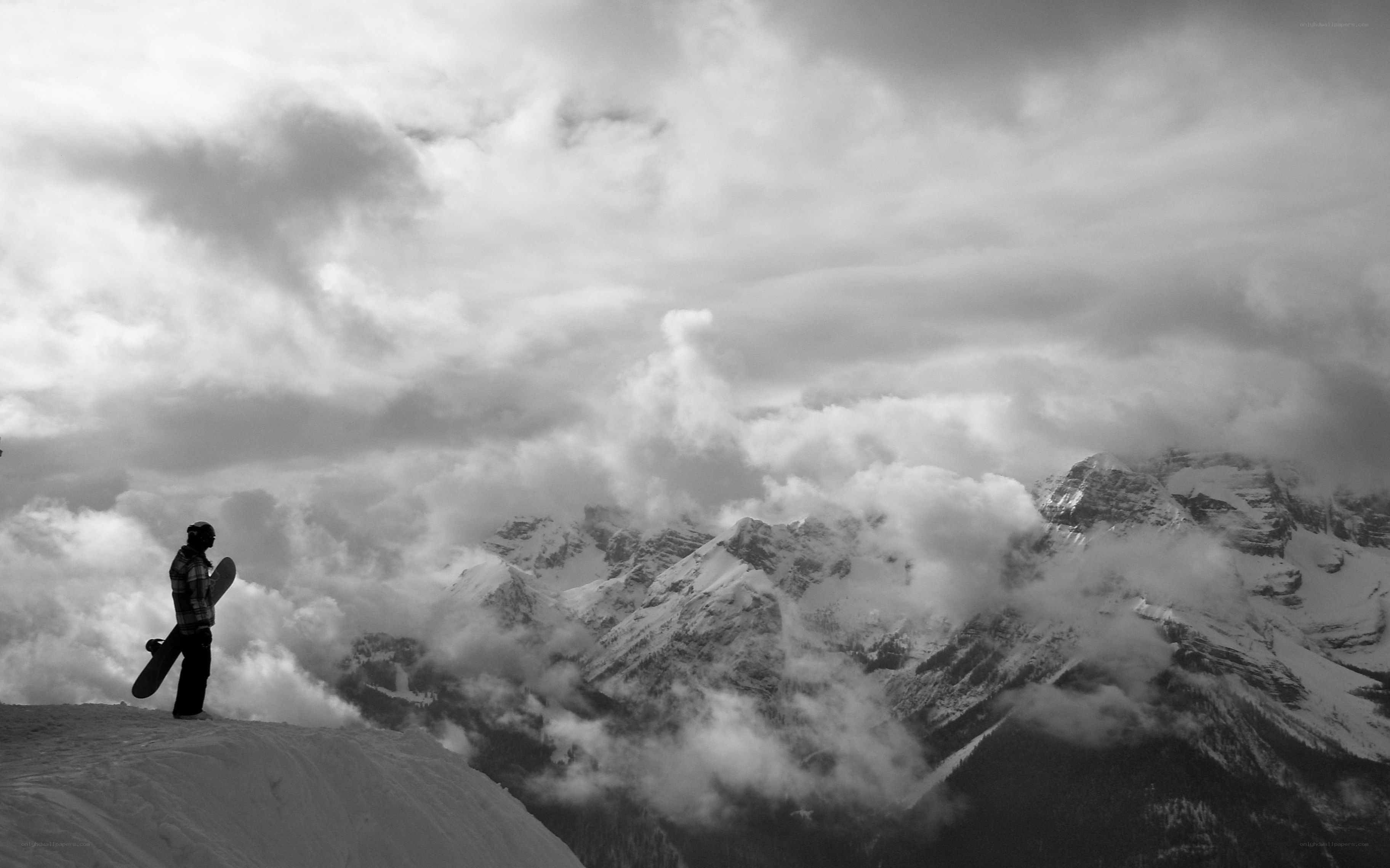 Snowboarder on a mountain peak