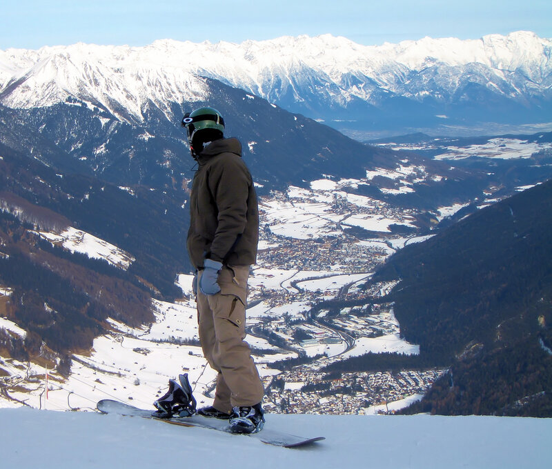 Snowboarder on a mountain peak