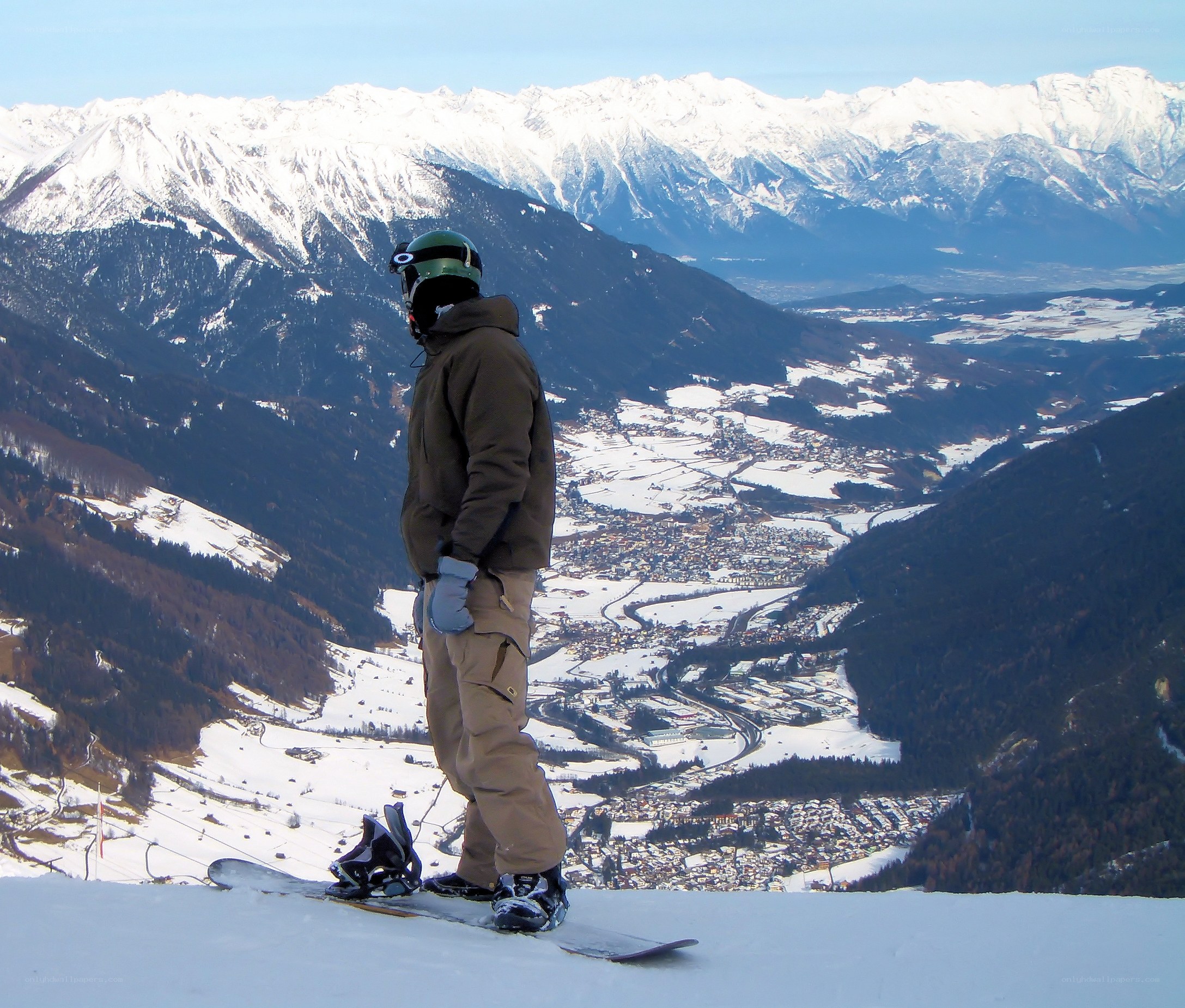Snowboarder on a mountain peak