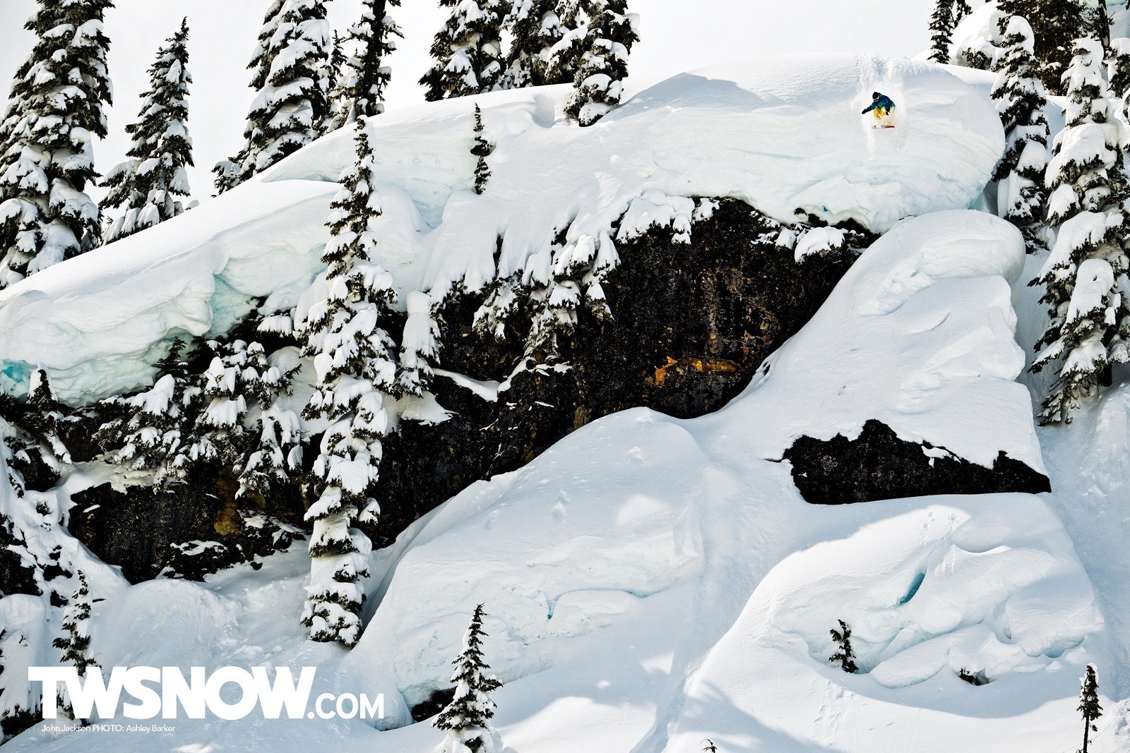 Snowboarder on a snowy cliff