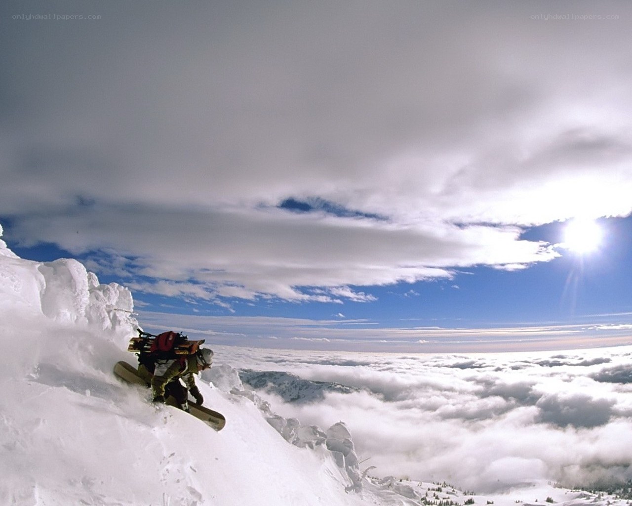 Snowboarder on a snowy ridge