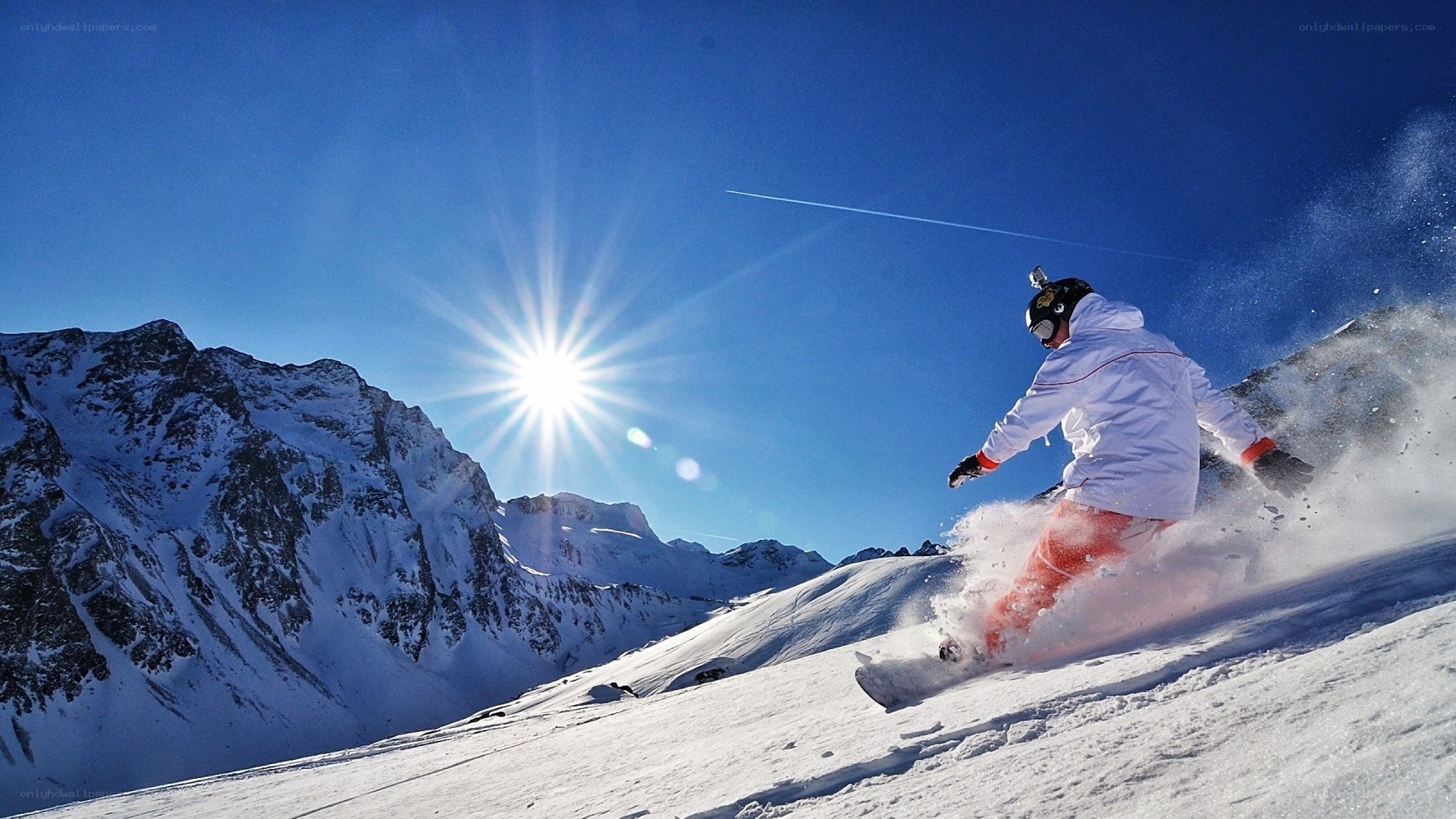 Snowboarder on a sunny mountain