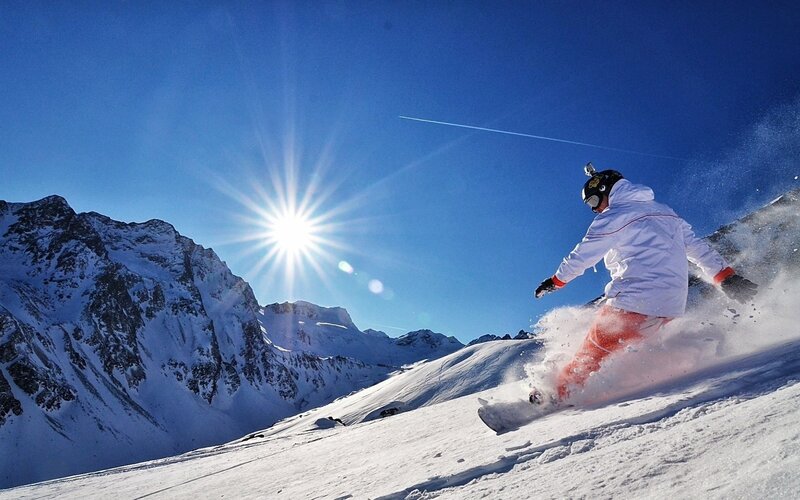 Snowboarder on a sunny mountain