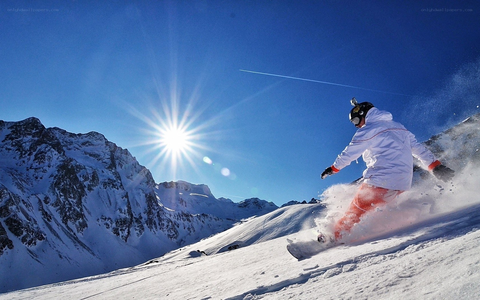 Snowboarder on a sunny mountain