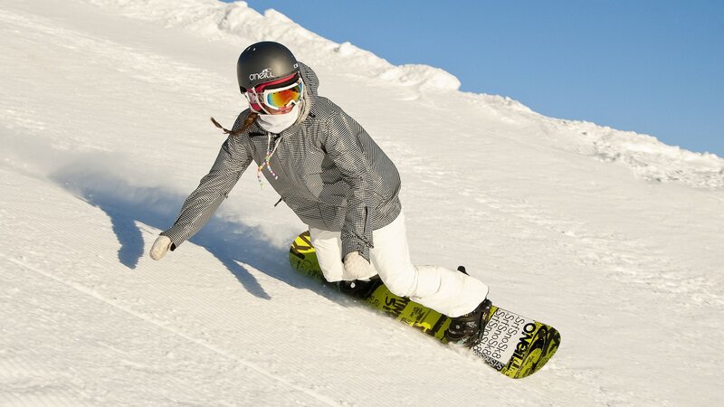 Snowboarder on a sunny slope