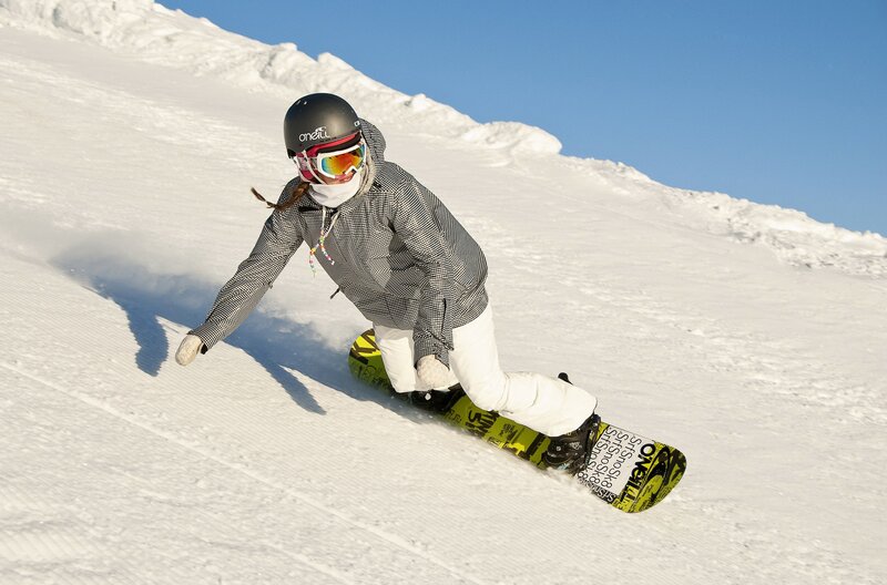 Snowboarder on a sunny slope