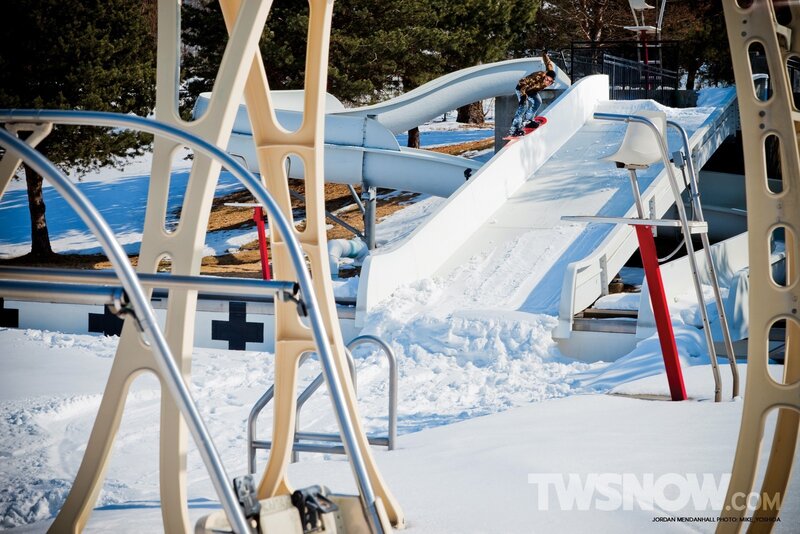 Snowboarder on a water slide