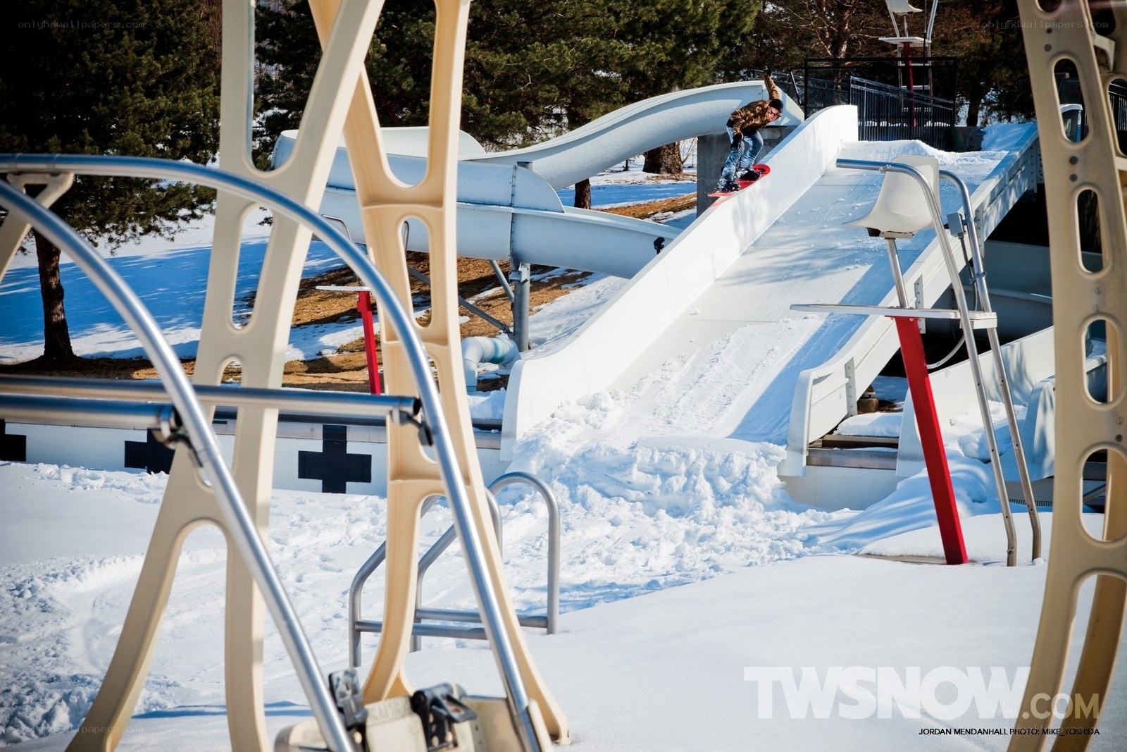 Snowboarder on a water slide