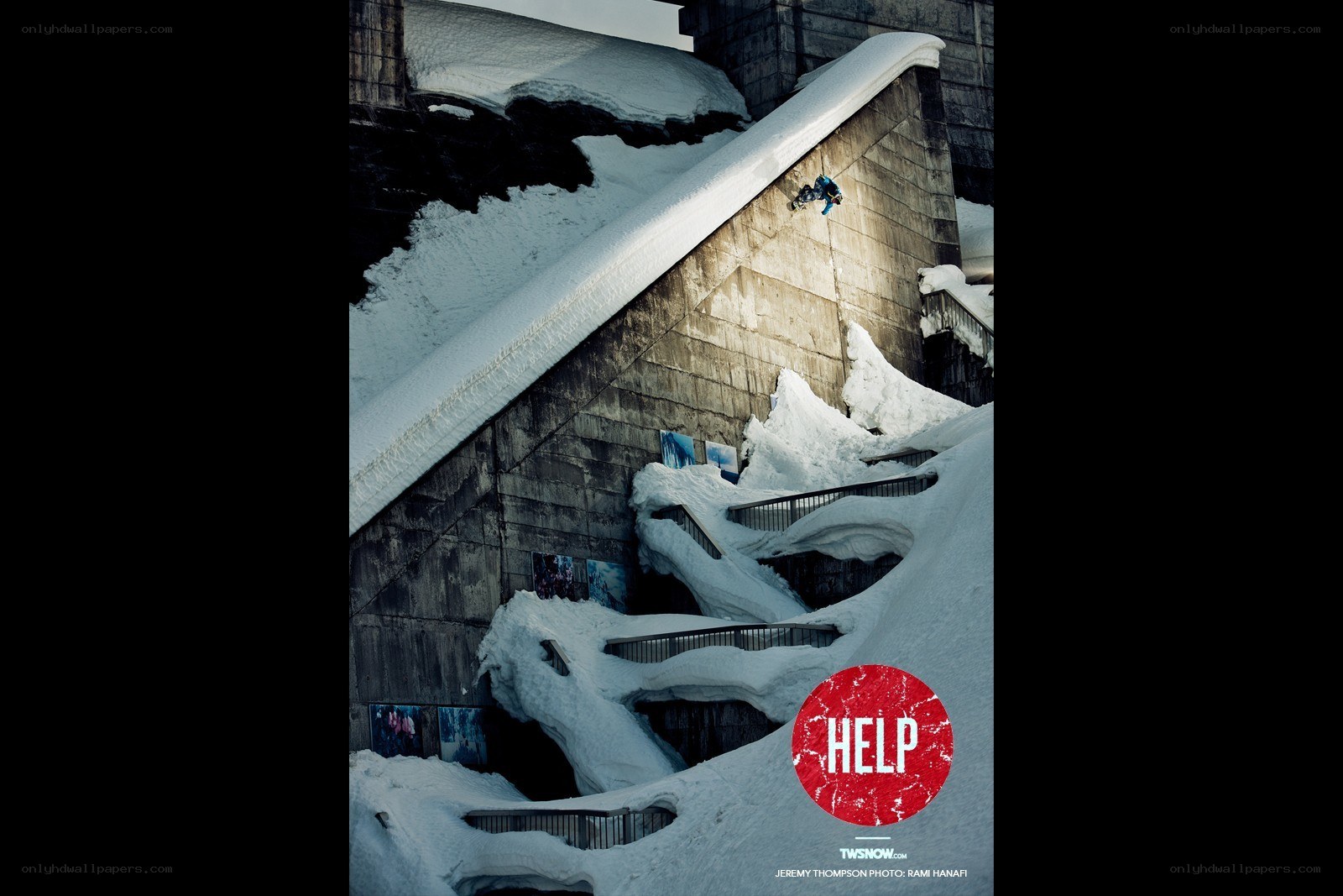 Snowboarder on concrete ramp