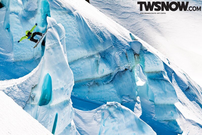 Snowboarder on icy cliff