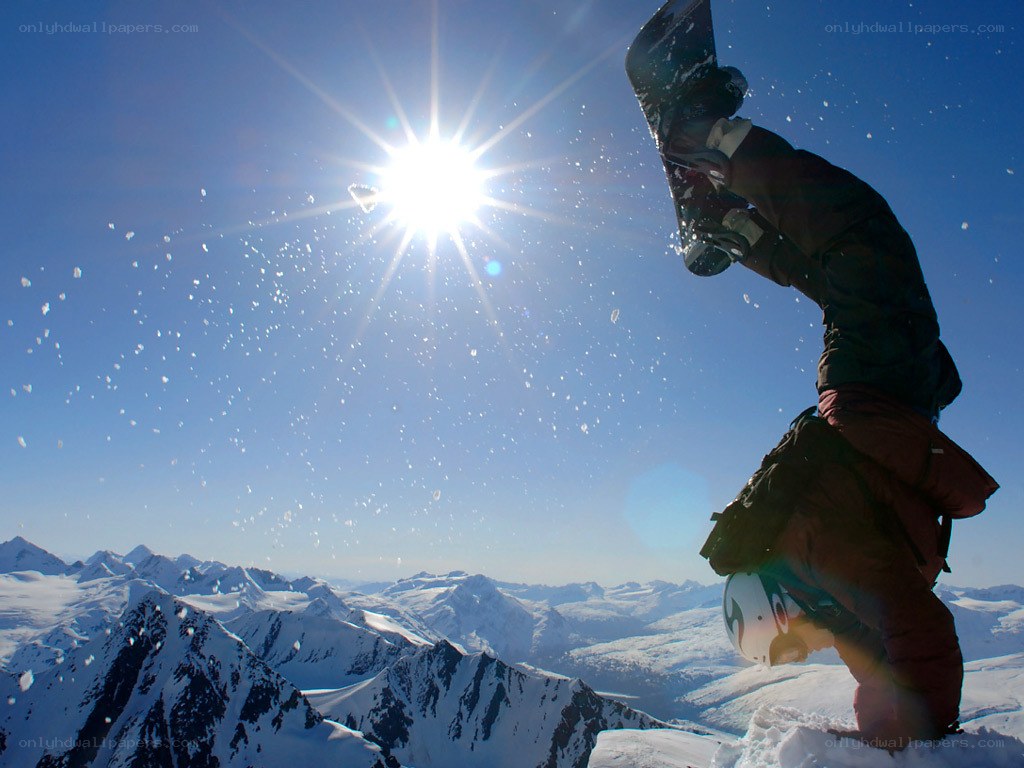 Snowboarder on mountain peak