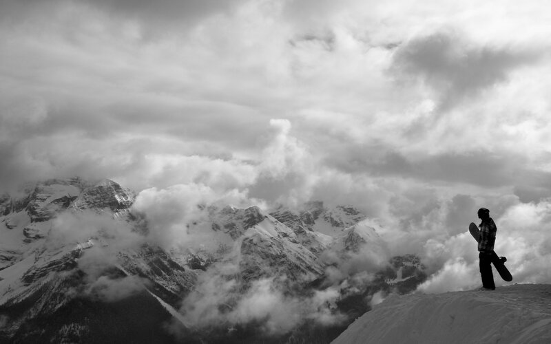 Snowboarder on mountain peak