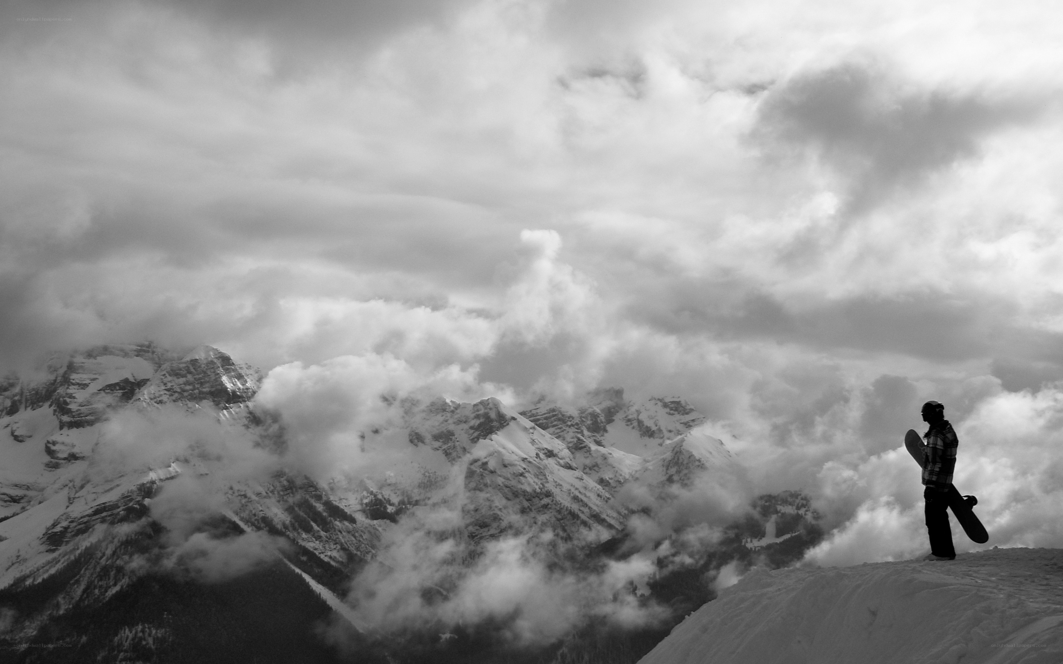Snowboarder on mountain peak