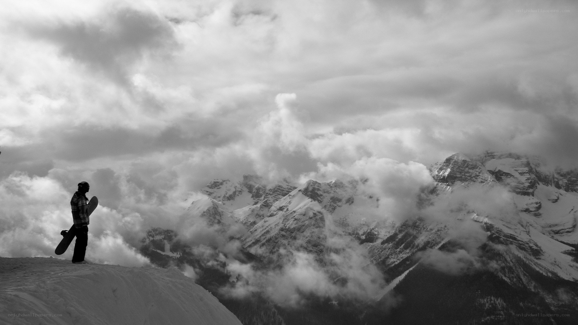 snowboarder on mountain peak