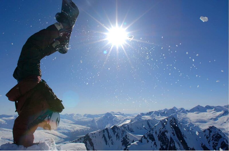 Snowboarder on mountain peak