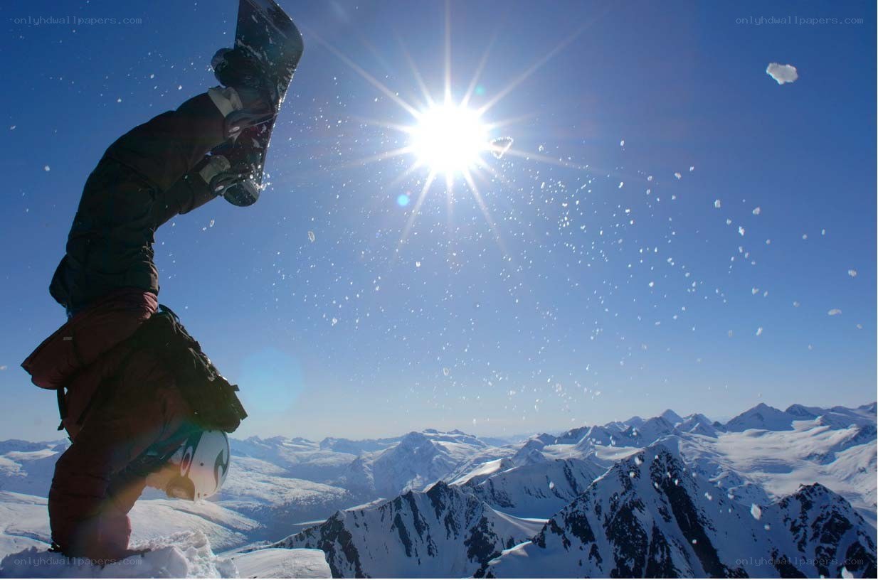 Snowboarder on mountain peak
