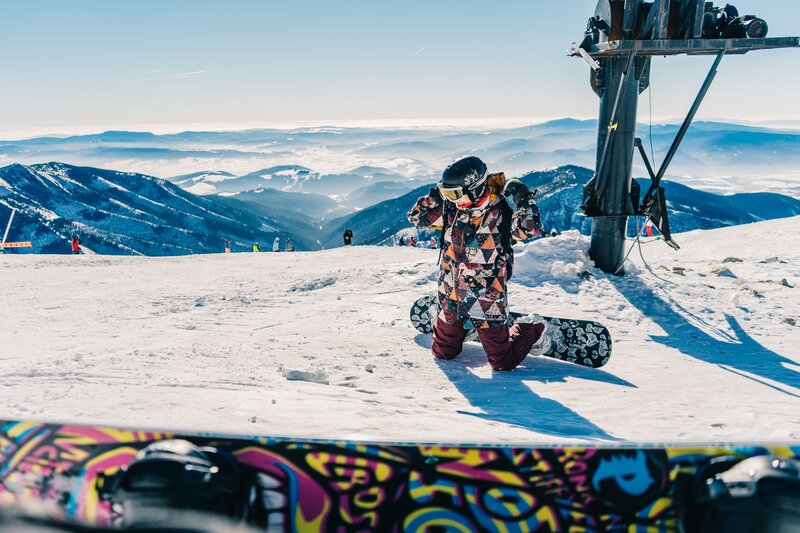 Snowboarder on mountain peak