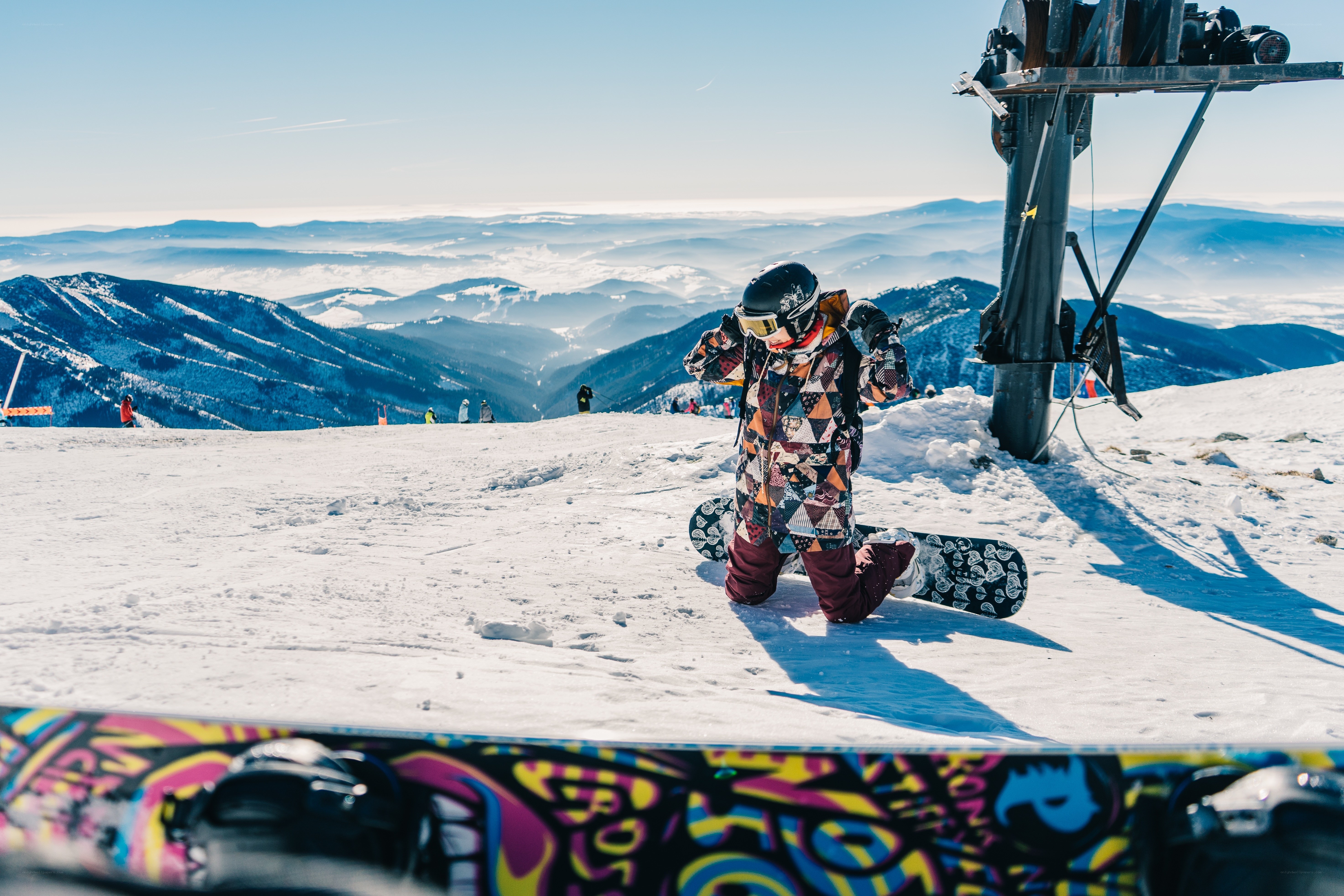 Snowboarder on mountain peak