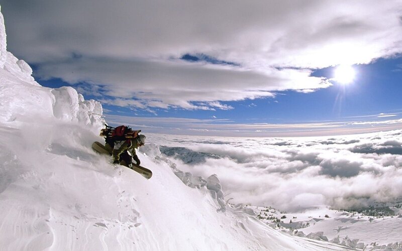 Snowboarder on Mountain — White, Dramatic, Afternoon, Photograph, Clouds, Sun, Backpack, Blue, Gray