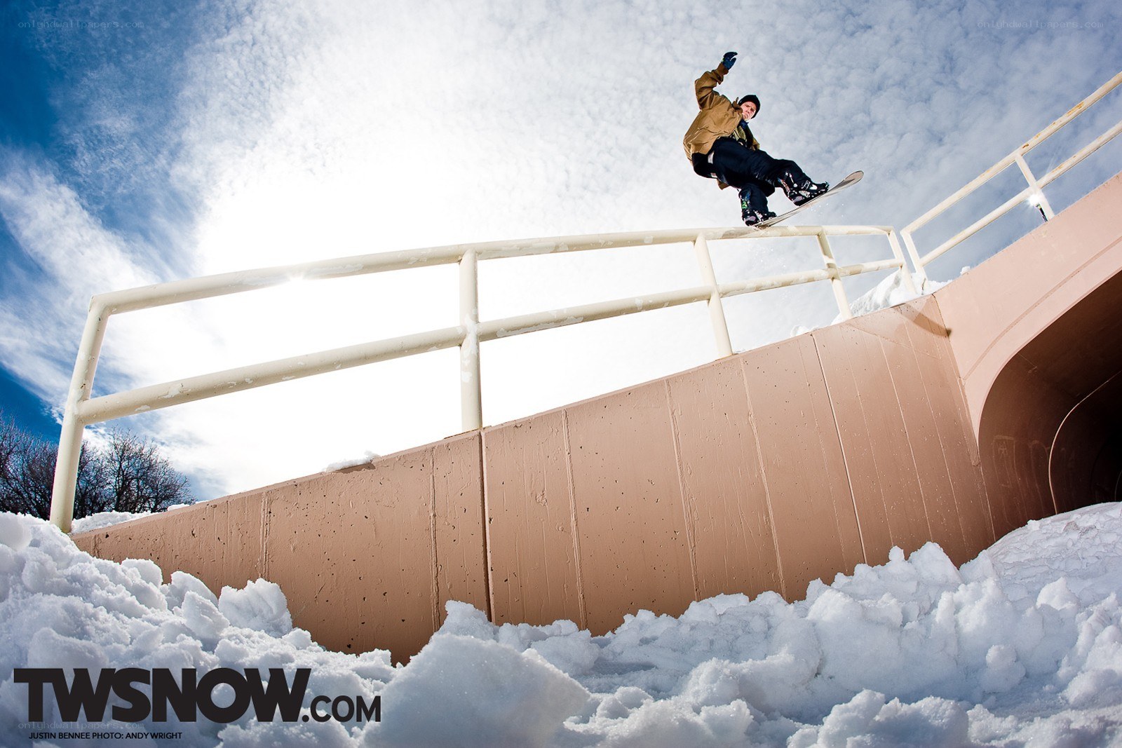 snowboarder on rail
