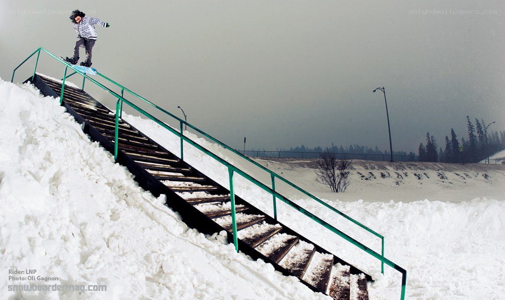 snowboarder on rail