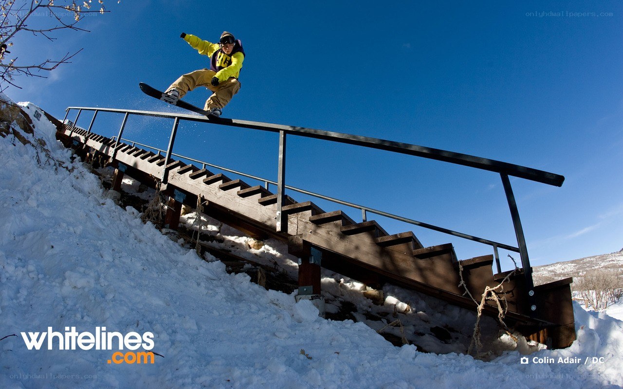Snowboarder on rail