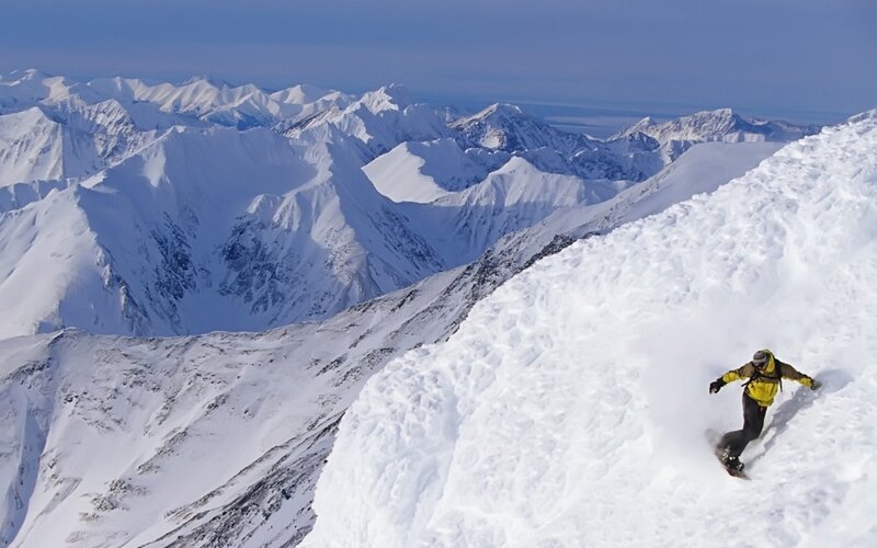 Snowboarder on snowy mountain