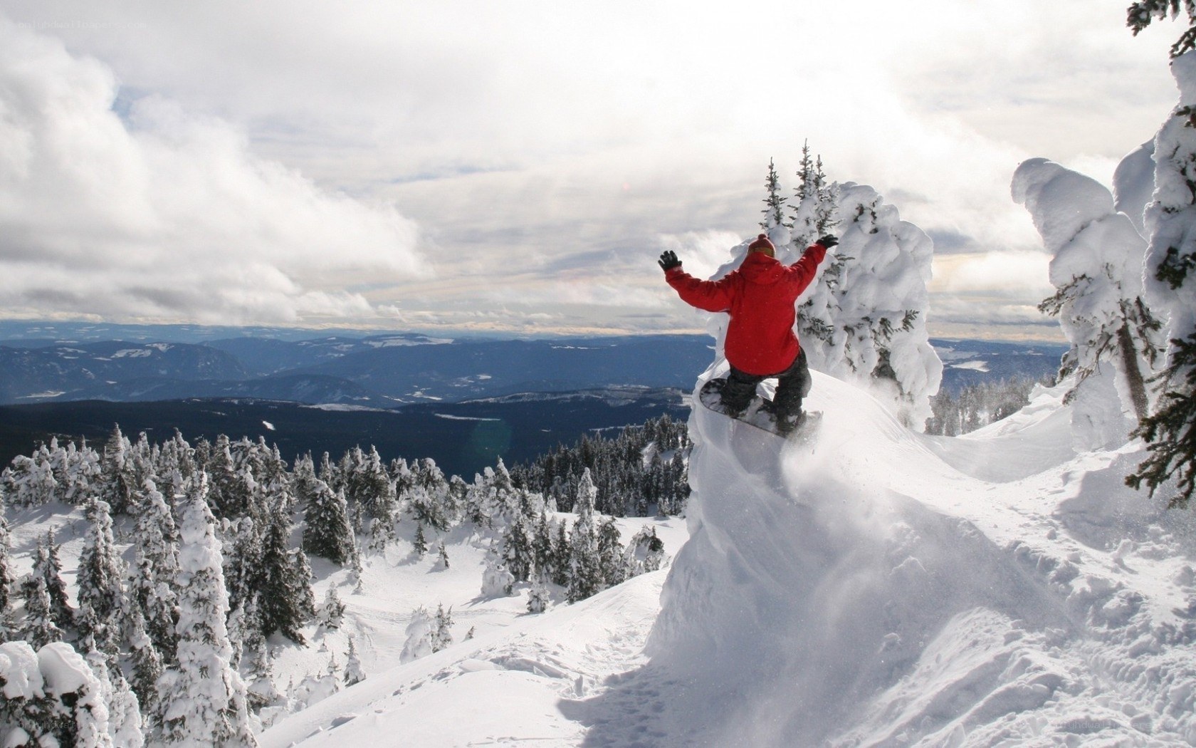 Snowboarder on snowy mountain