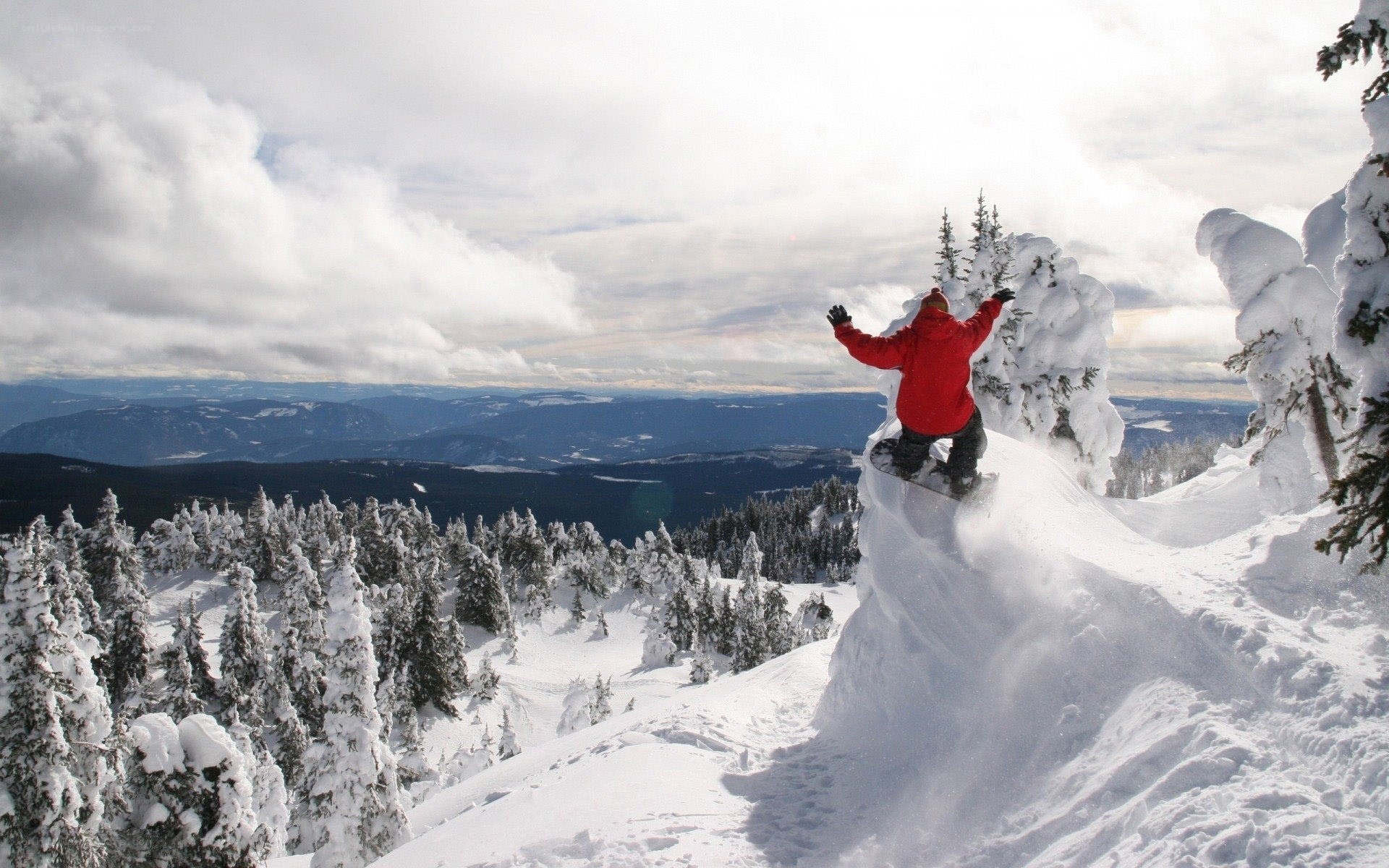 Snowboarder on snowy mountain