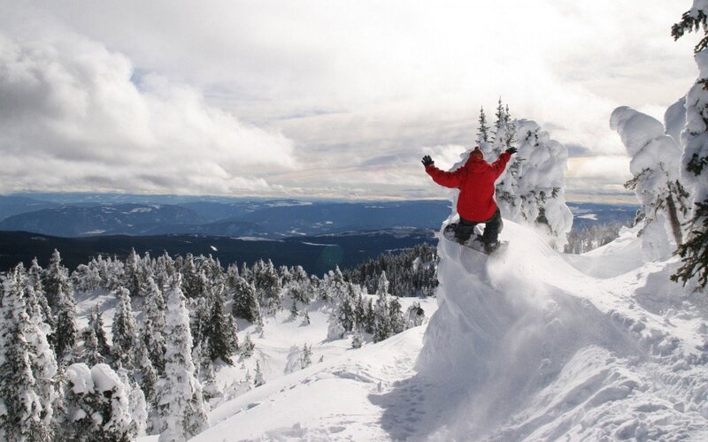 Snowboarder on snowy peak