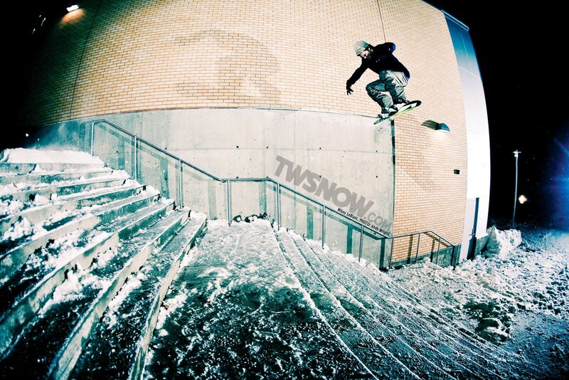 snowboarder on stairs at night