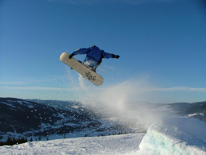 Snowboarder performing jump