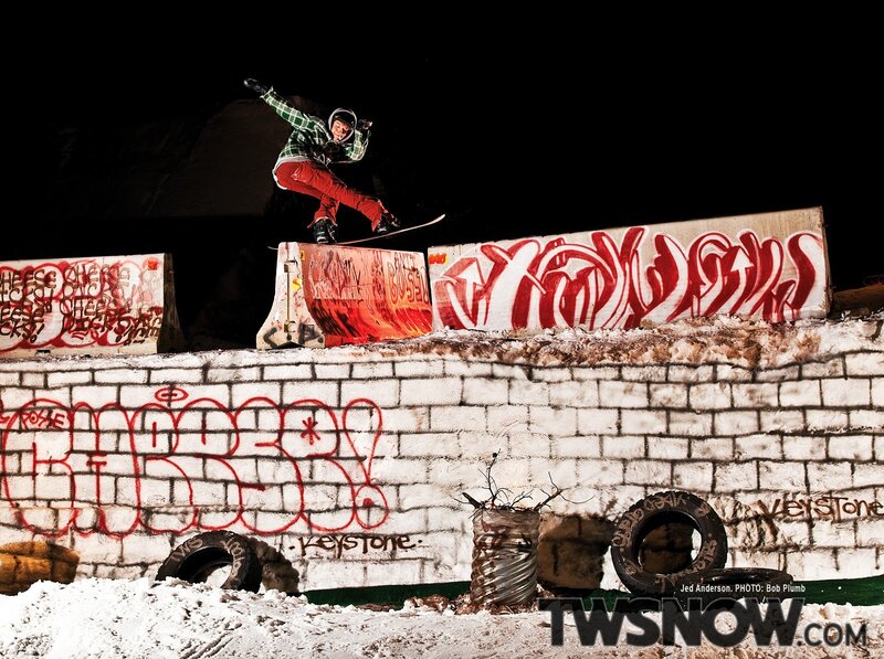 snowboarder performing trick at night