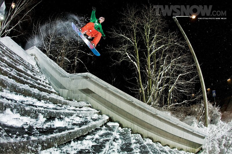 snowboarder performing trick at night